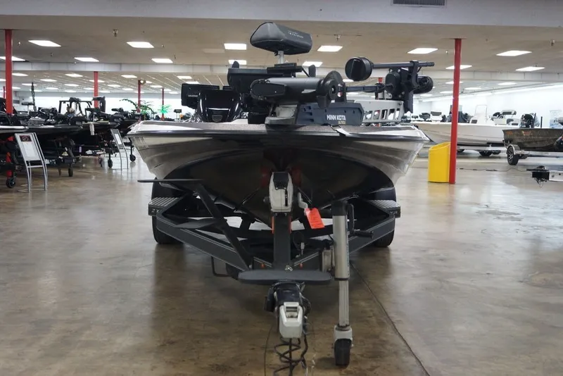 Slide: The Image of 2023 Skeeter ZXR21 boat displayed indoors, showcasing advanced fishing equipment. - 5