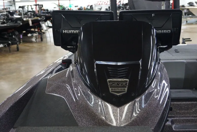 Slide: The Image of 2023 Skeeter ZXR21 boat with dual Humminbird displays in showroom. - 23