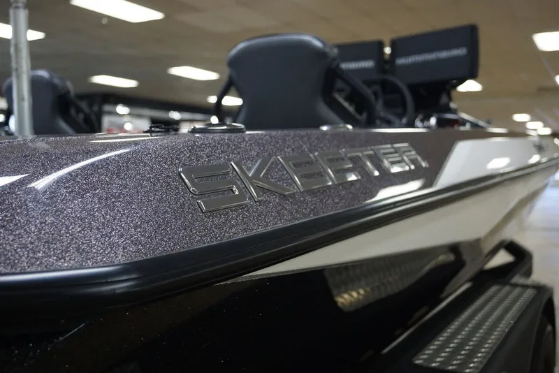 Slide: The Image of 2023 Skeeter ZXR21 boat close-up with sleek design and logo detail. - 16