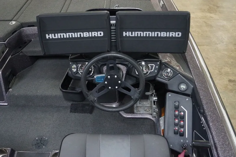 Slide: The Image of 2023 Skeeter ZXR21 boat cockpit with dual Humminbird displays and steering wheel. - 8