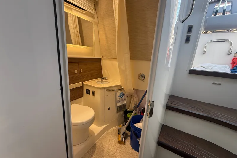 Slide: The Image of Interior of 2024 Boston Whaler 420 Outrage boat bathroom with modern amenities. - 43