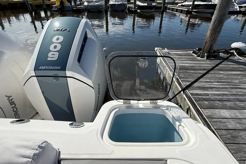 Slide: The Image of 2024 Boston Whaler 420 Outrage with Mercury 600 engine at dockside. - 12