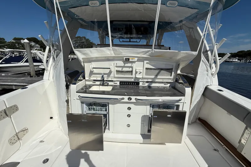 Slide: The Image of 2024 Boston Whaler 420 Outrage boat interior with modern kitchen amenities. - 22