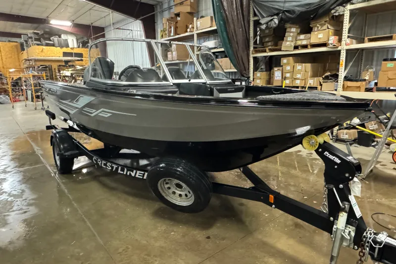 Slide: The Image of 2020 Crestliner 1850 Super Hawk boat on trailer in a warehouse setting. - 2