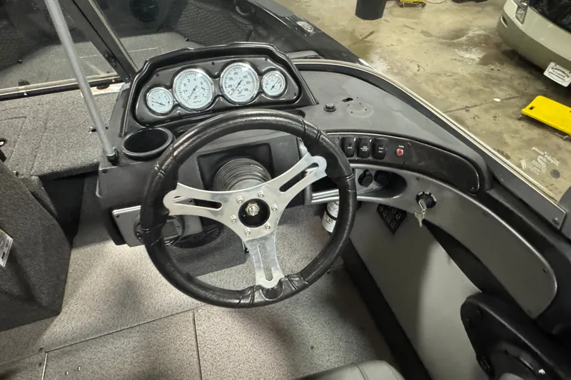 Slide: The Image of 2020 Crestliner 1850 Super Hawk dashboard with steering wheel and instrument panel. - 9