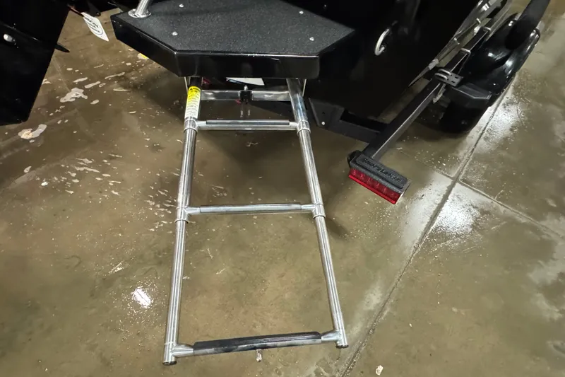Slide: The Image of Rear view of 2020 Crestliner 1850 Super Hawk with extended boarding ladder. - 6