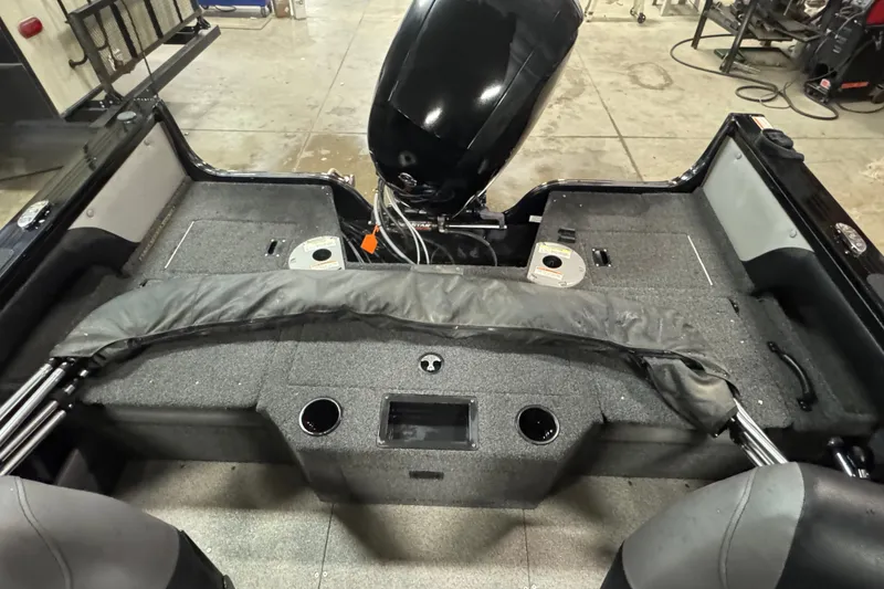 Slide: The Image of 2020 Crestliner 1850 Super Hawk boat interior with motor and storage compartments. - 12