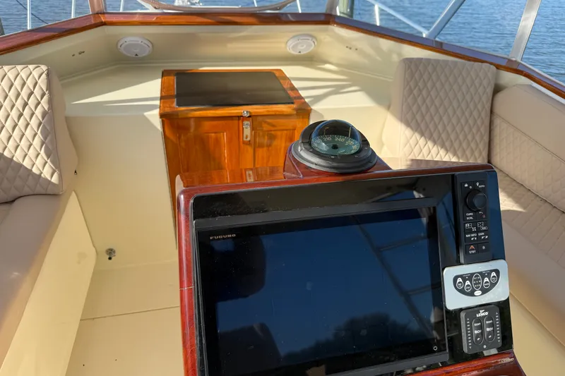 Slide: The Image of Helm of 1998 Dorado 36 Express boat with navigation equipment and seating. - 23