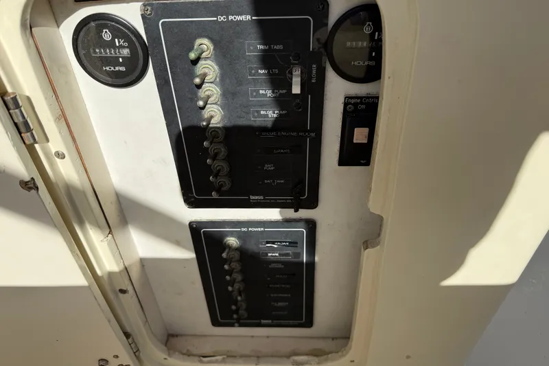 Slide: The Image of Control panel of a 1998 Dorado 36 Express boat, featuring DC power switches. - 20