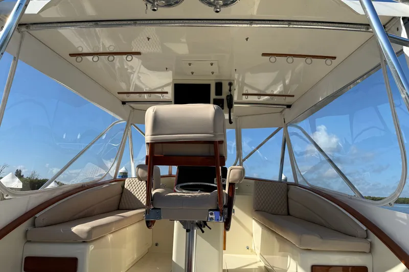 Slide: The Image of Interior view of 1998 Dorado 36 Express boat with seating and helm. - 56
