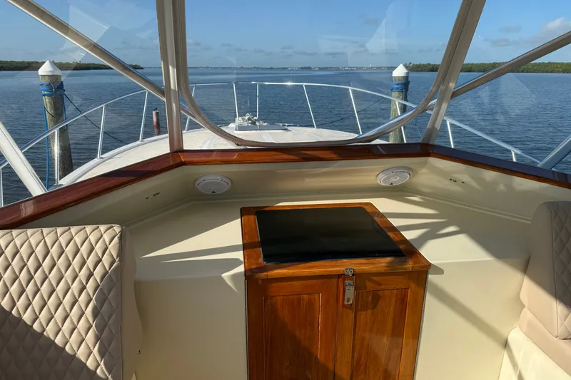 Slide: The Image of 1998 Dorado 36 Express boat interior with wooden cabinetry and scenic water view. - 24