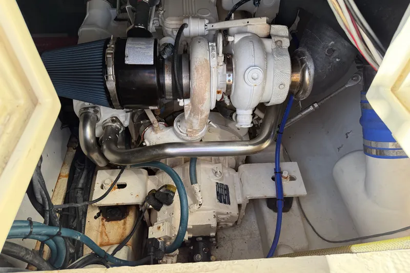Slide: The Image of Engine compartment of a 1998 Dorado 36 Express boat, showcasing mechanical components. - 50