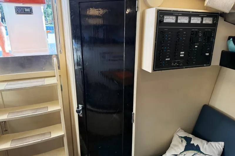 Slide: The Image of Interior of 1998 Dorado 36 Express boat with control panel and stairs. - 38