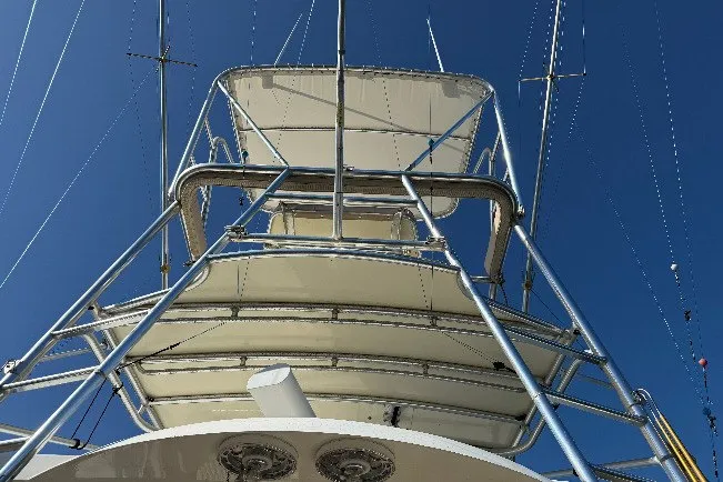 Slide: The Image of 1998 Dorado 36 Express boat tower against clear blue sky. - 55
