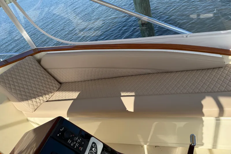 Slide: The Image of Interior of 1998 Dorado 36 Express boat with quilted seating and wooden trim. - 22