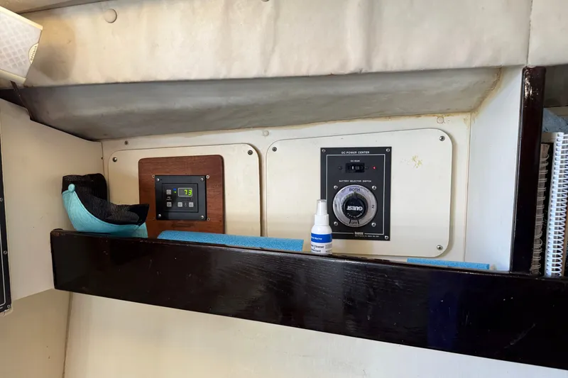 Slide: The Image of Control panel inside a 1998 Dorado 36 Express boat, featuring a battery selector switch. - 37