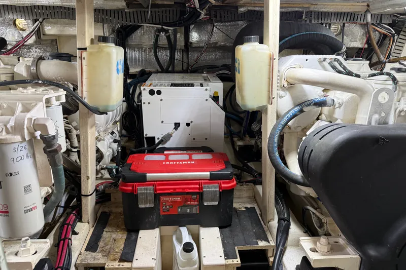 Slide: The Image of Engine room of 1998 Dorado 36 Express with Craftsman toolbox and mechanical components. - 48