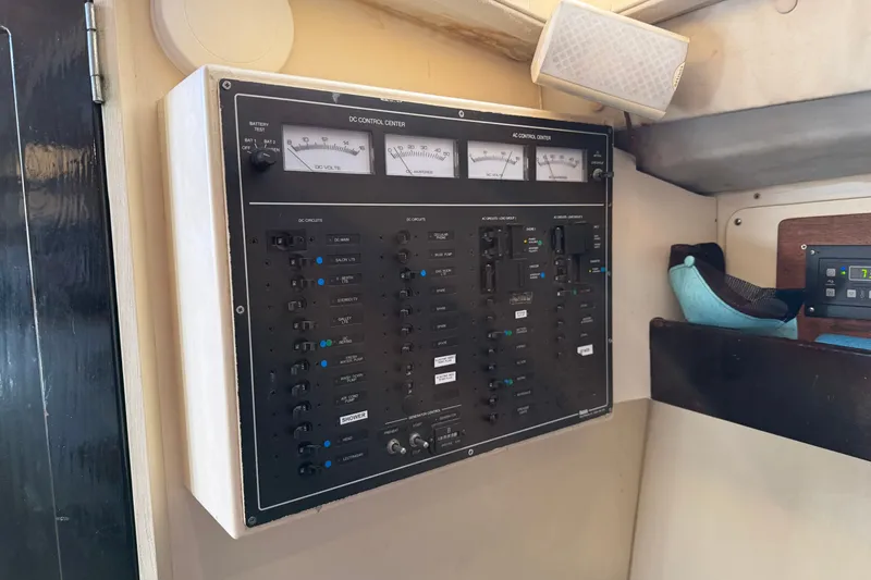 Slide: The Image of Electrical control panel inside a 1998 Dorado 36 Express boat cabin. - 36