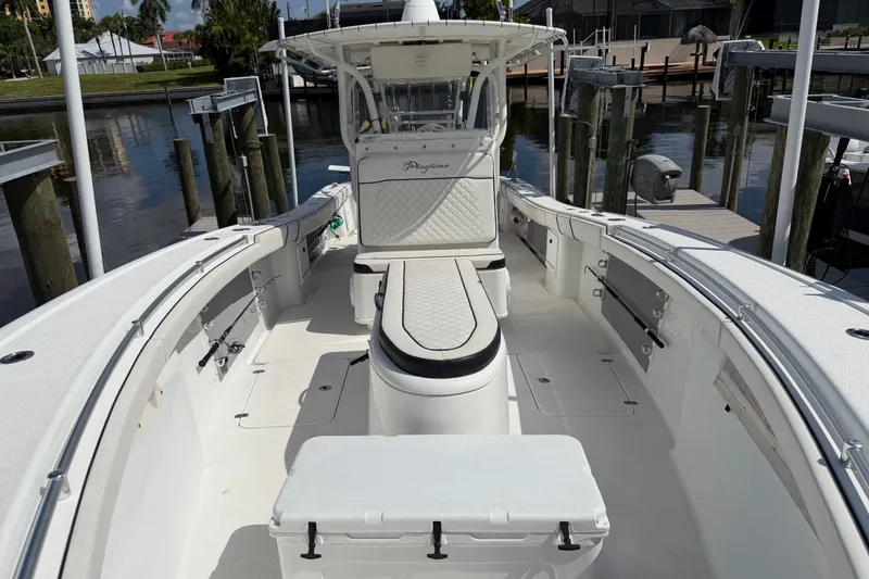Slide: The Image of 2006 Yellowfin 36 Offshore boat docked, featuring spacious seating and sleek design. - 8