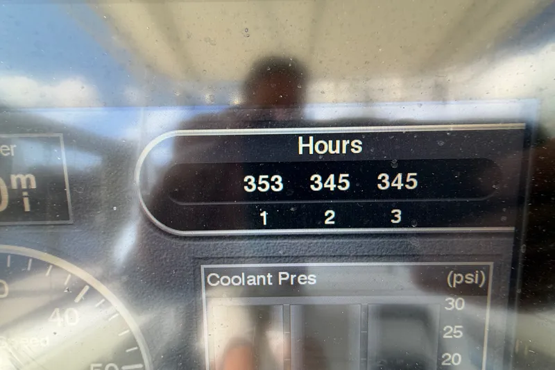 Slide: The Image of Display panel showing engine hours for a 2006 Yellowfin 36 Offshore boat. - 21