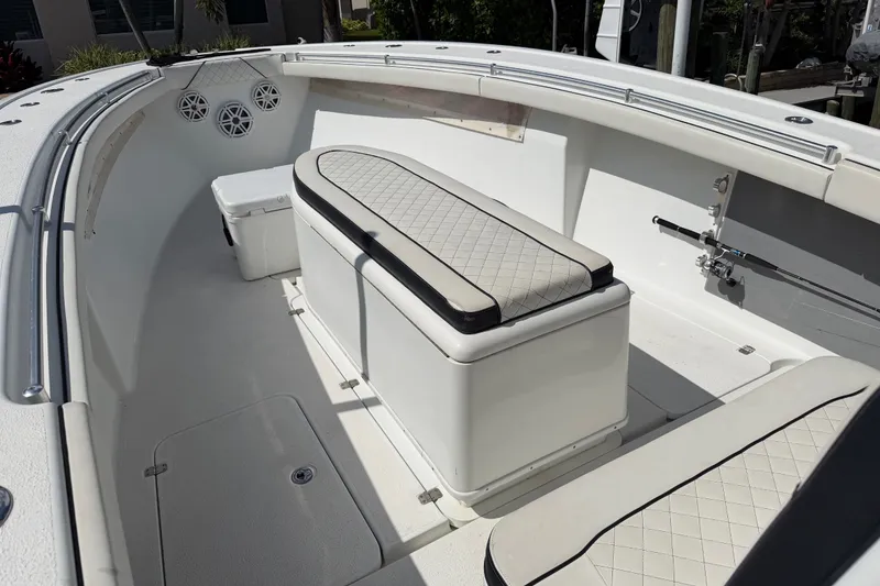 Slide: The Image of 2006 Yellowfin 36 Offshore boat interior with cushioned seating and fishing rod holder. - 10