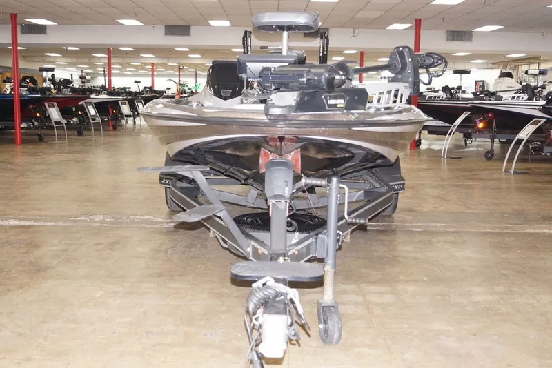 Slide: The Image of 2025 Skeeter ZXR20 boat displayed in a showroom, front view. - 14