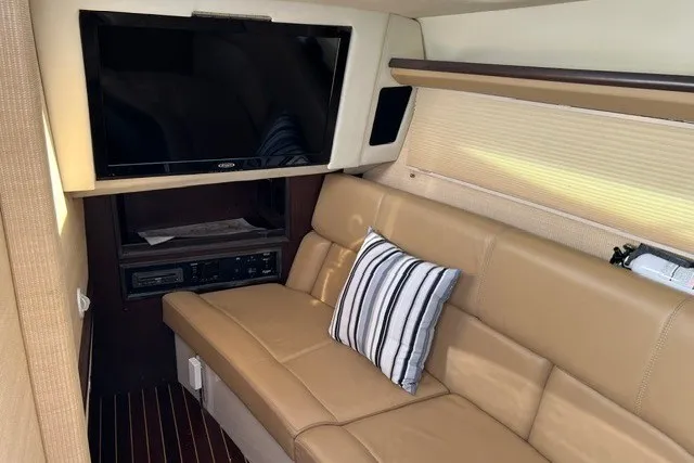 Slide: The Image of Luxurious interior of a 2016 Cobalt 336 boat with leather seating and a mounted TV. - 5
