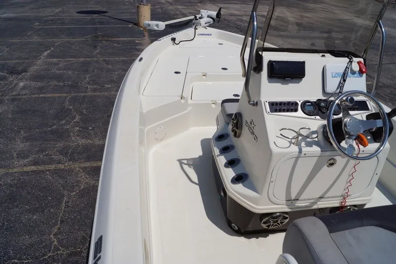 Slide: The Image of 2025 Skeeter SX2250 boat interior with steering console and navigation equipment. - 11