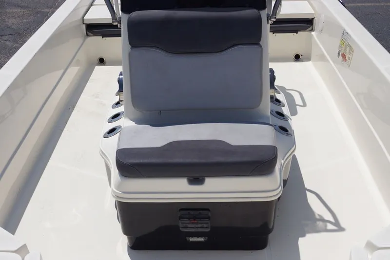 Slide: The Image of 2025 Skeeter SX2250 boat interior with cushioned seating and cup holders. - 18