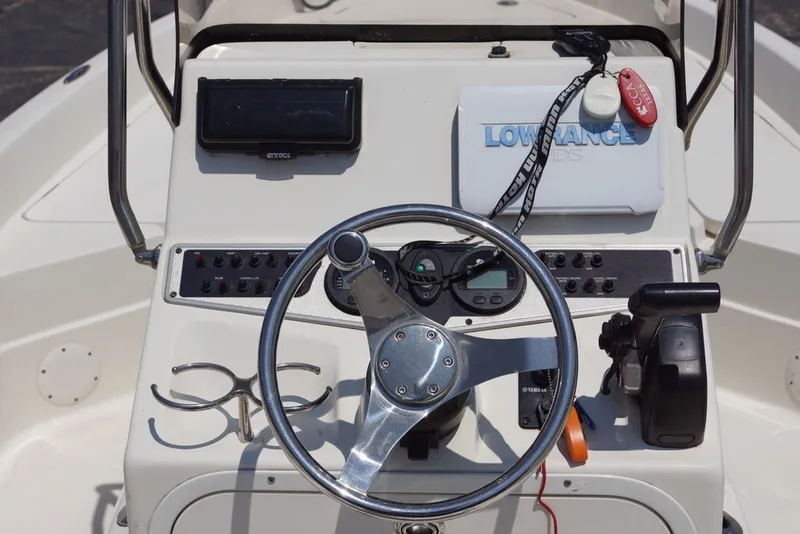 Slide: The Image of Steering console of 2025 Skeeter SX2250 boat with navigation equipment and controls. - 6