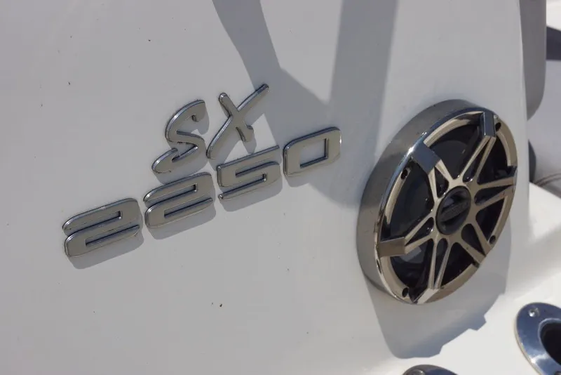 Slide: The Image of 2025 Skeeter SX2250 boat emblem and speaker detail on white surface. - 17