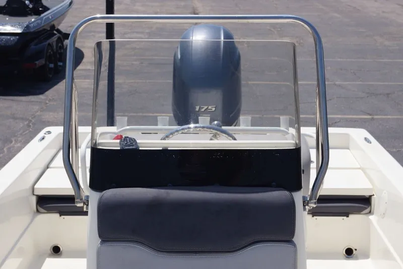 Slide: The Image of 2025 Skeeter SX2250 boat console with windshield and 175 horsepower engine. - 23
