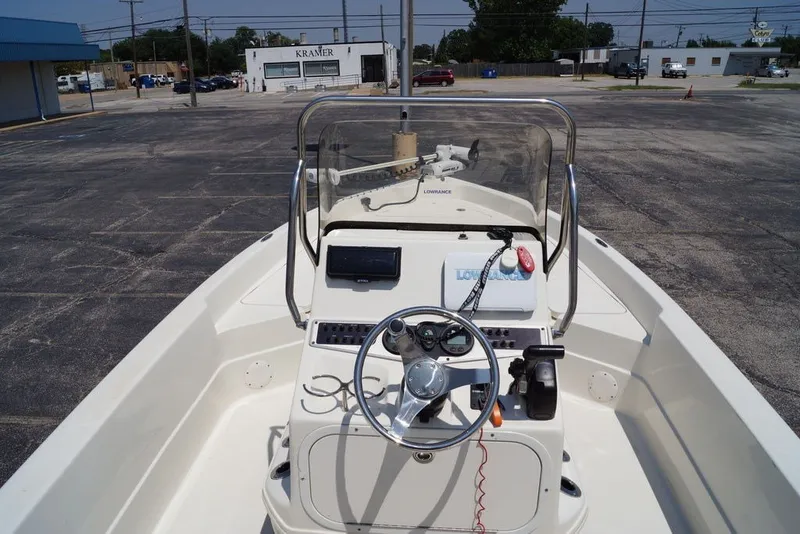 Slide: The Image of 2025 Skeeter SX2250 boat console with steering wheel and navigation equipment. - 8
