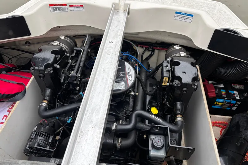 Slide: The Image of Engine compartment of a 2010 Sea Ray 185 Sport boat, showcasing mechanical components. - 7