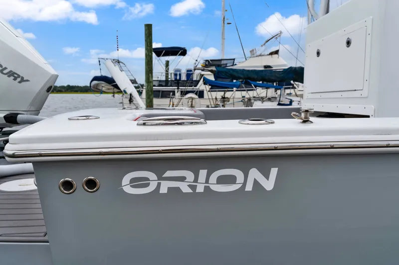 Slide: The Image of 2025 Orion 29 boat docked, showcasing sleek design and branding. - 3