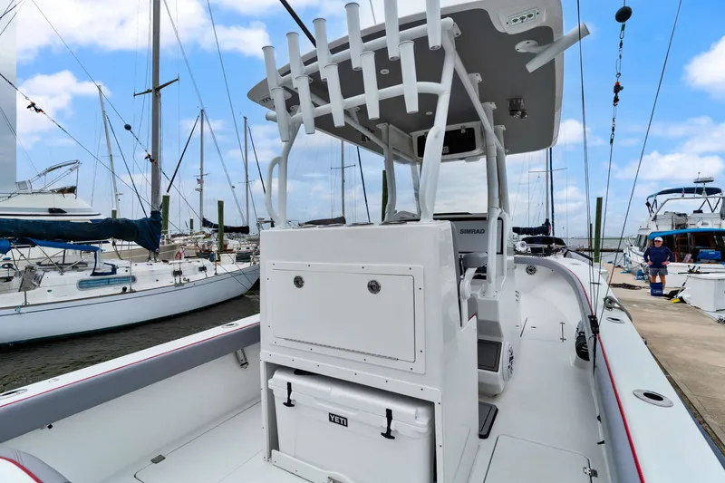 Slide: The Image of 2025 Orion 29 boat docked at marina, featuring modern design and equipment. - 10