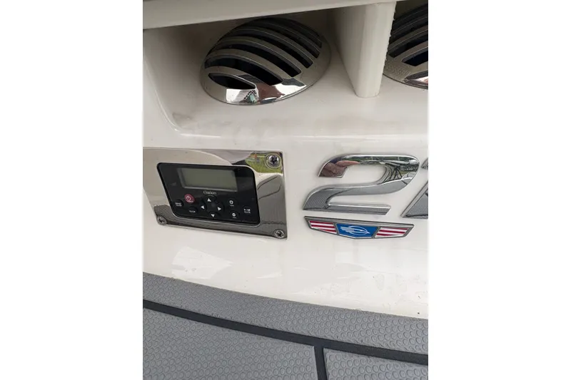 Slide: The Image of 2021 Chaparral 21 SSi boat dashboard with control panel and speaker grille. - 17