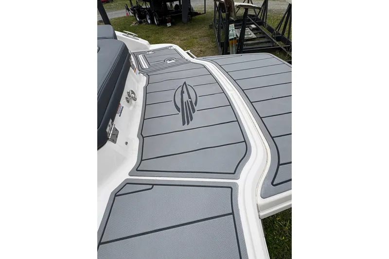 Slide: The Image of 2021 Chaparral 21 SSi boat deck with gray non-slip surface and logo design. - 16
