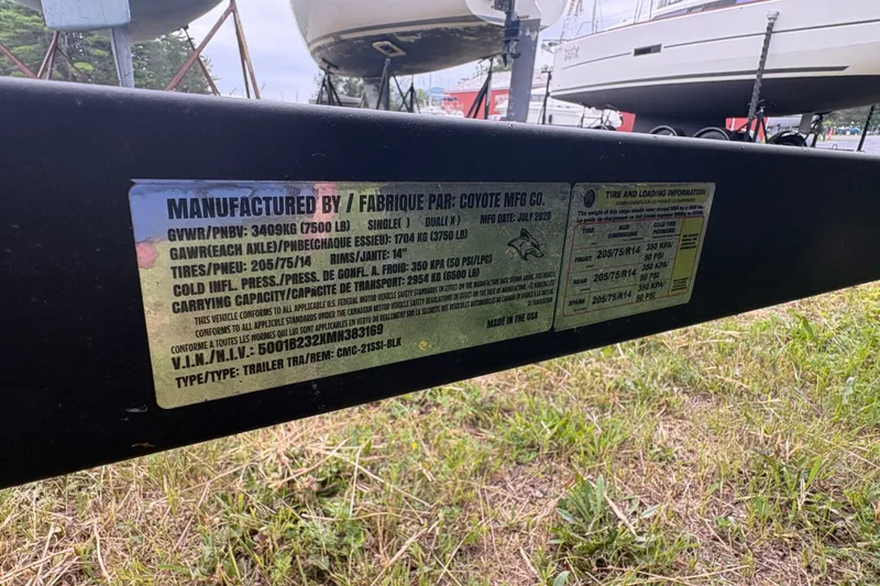 Slide: The Image of Trailer label with specifications and tire information, manufactured by Coyote MFG Co. - 19