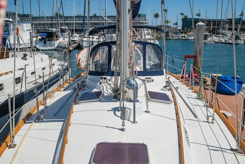 Slide: The Image of 1988 Hylas 44 Center Cockpit sailboat docked in a sunny marina. - 73