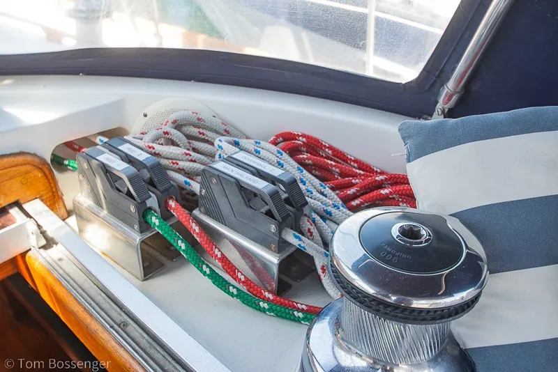 Slide: The Image of Cockpit of 1988 Hylas 44 Center Cockpit sailboat with winches and colorful ropes. - 62