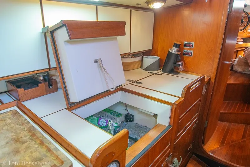Slide: The Image of Interior of 1988 Hylas 44 Center Cockpit yacht with open storage compartment. - 19