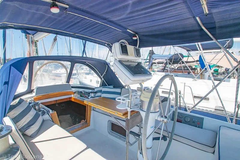 Slide: The Image of 1988 Hylas 44 Center Cockpit sailboat interior with navigation equipment and seating. - 46