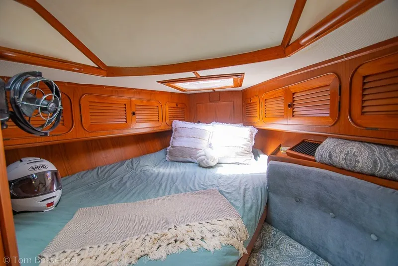 Slide: The Image of Cozy cabin interior of 1988 Hylas 44 Center Cockpit sailboat with wooden accents. - 30