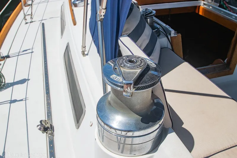 Slide: The Image of Winch on 1988 Hylas 44 Center Cockpit sailboat deck, with cockpit view. - 57