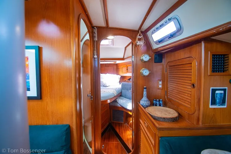 Slide: The Image of Interior of 1988 Hylas 44 Center Cockpit yacht, featuring cozy wooden cabin design. - 29