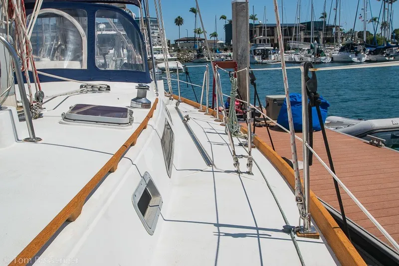 Slide: The Image of 1988 Hylas 44 Center Cockpit sailboat docked at marina, sunny day, clear blue water. - 74