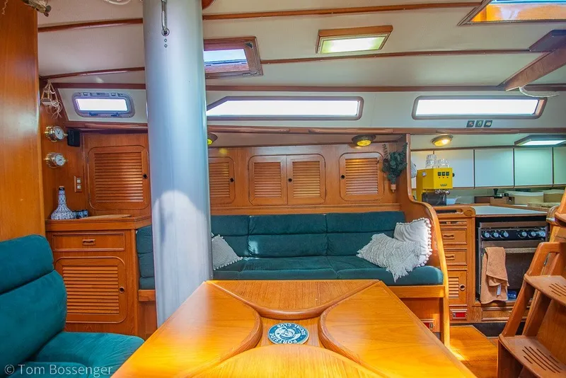 Slide: The Image of Interior of 1988 Hylas 44 Center Cockpit yacht with wooden furnishings and cozy seating. - 14