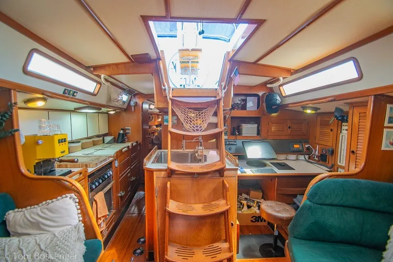 Slide: The Image of Interior of 1988 Hylas 44 Center Cockpit yacht, featuring wood finishes and cozy seating. - 41