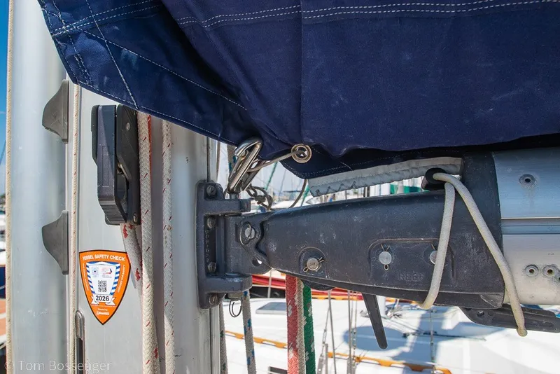 Slide: The Image of Close-up of 1988 Hylas 44 Center Cockpit sailboat mast with safety check sticker. - 67